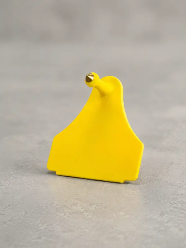 Boucle d'identification mâle médium jaune, tige à pointe métallique